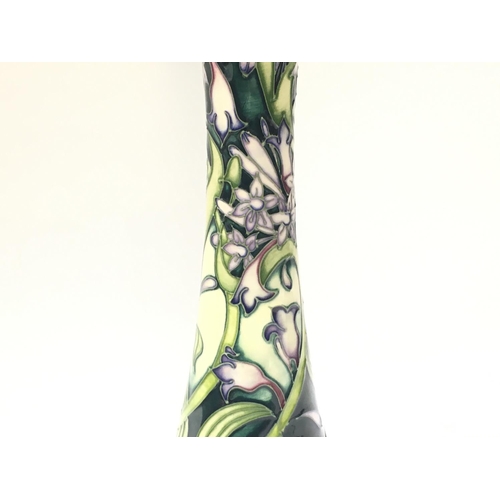 1152 - A boxed Moorcroft vase in the Isis pattern designed by Emma Bossons, approximately 31.5cm tall. No o... 