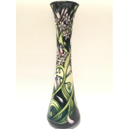 1152 - A boxed Moorcroft vase in the Isis pattern designed by Emma Bossons, approximately 31.5cm tall. No o... 