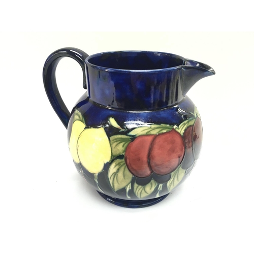 1190 - A Moorcroft jug. 17cm tall.