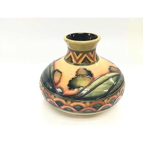 1191 - A Moorcroft Trial vase T/D01608. 11cm tall and in good condition.