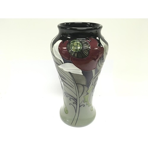 1194 - A Moorcroft vase titled C wood limited edition numbered 51 of 100. 26cm tall. Good condition.