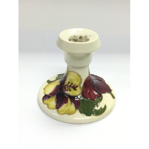 1203 - A small Moorcroft candlestick, approx height 8.5cm. Shipping category D.- NO RESERVE