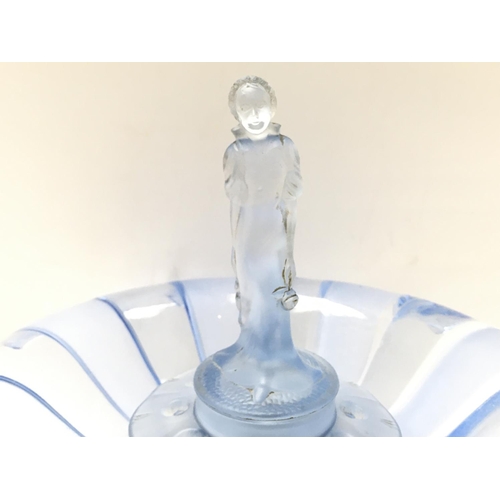 1216 - An early 20th century blue coloured glass flower arranger, some chips. Approximately 28cm tall posta... 