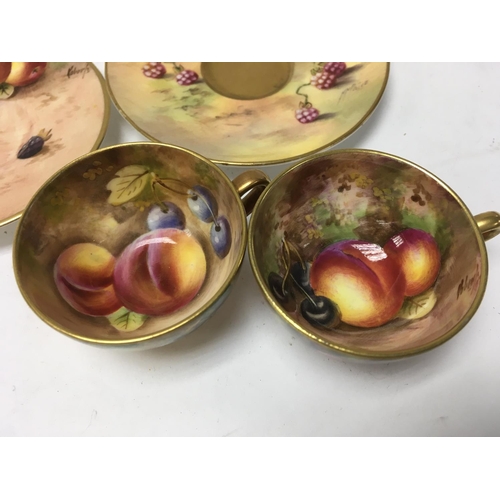 1251 - Two small Royal Worcester cups and saucers decorated with fruit.5.5 cm no damage or restoration.