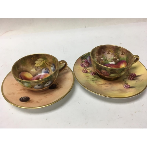 1251 - Two small Royal Worcester cups and saucers decorated with fruit.5.5 cm no damage or restoration.