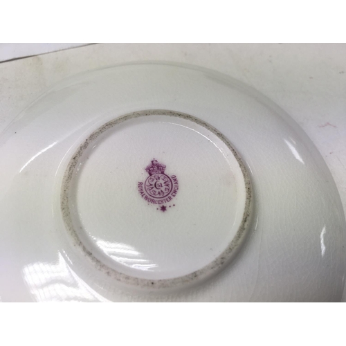 1251 - Two small Royal Worcester cups and saucers decorated with fruit.5.5 cm no damage or restoration.