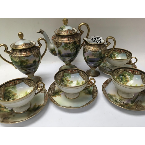 1255 - A Japanese noritake tea set comprising tea pot milk jug and sugar bowl with four cups and saucers.