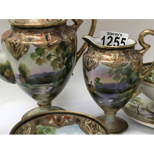 1255 - A Japanese noritake tea set comprising tea pot milk jug and sugar bowl with four cups and saucers.