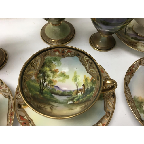 1255 - A Japanese noritake tea set comprising tea pot milk jug and sugar bowl with four cups and saucers.