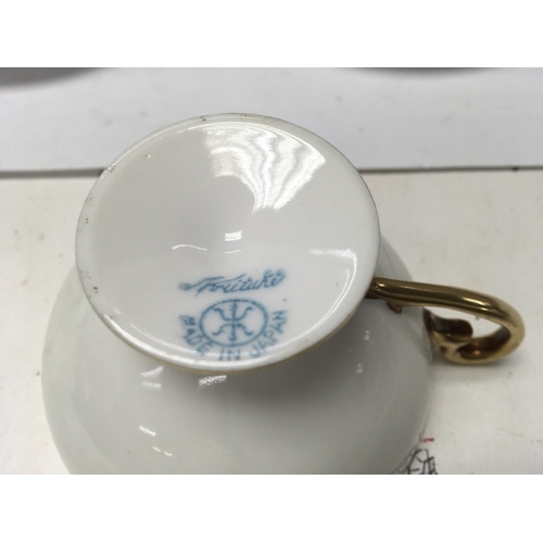 1255 - A Japanese noritake tea set comprising tea pot milk jug and sugar bowl with four cups and saucers.