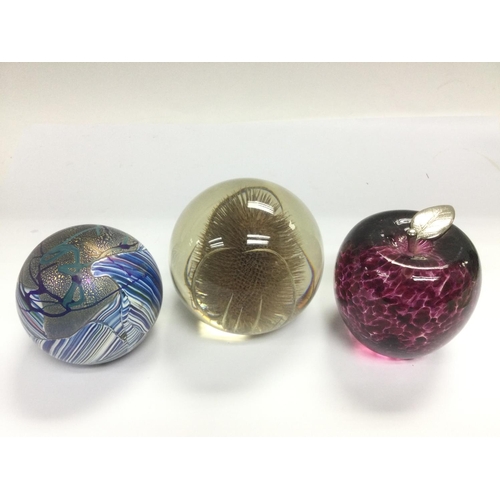 1262 - Three glass paperweights including an Isle of Wight example. Shipping category D.