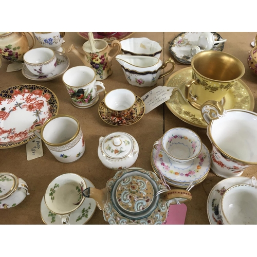 1263 - A collection of miniature cups and saucers including Derby and Dresden.