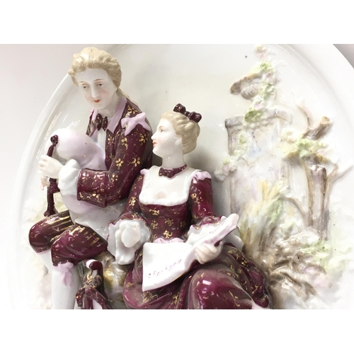 1308 - Early 20th century Porcelain figure wall group. 26.5cm in diameter. Postage category D