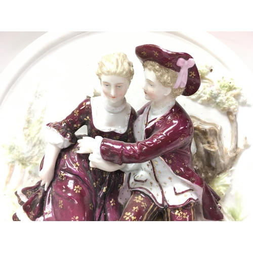 1308 - Early 20th century Porcelain figure wall group. 26.5cm in diameter. Postage category D