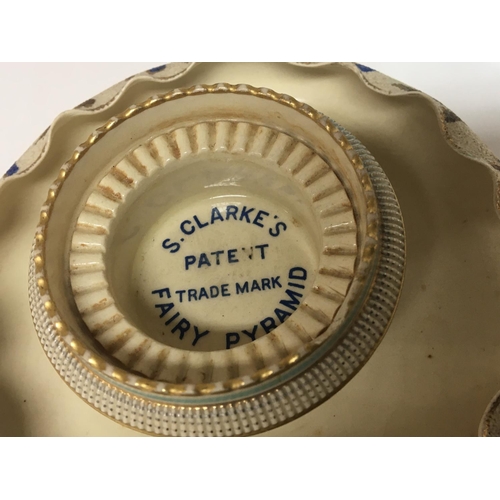 1338 - An unusual late Victorian ceramic and glass candle holder S Clarkes Patent Fairy Pyramid. Made by Ma... 