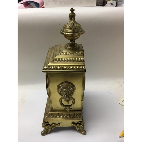 1412 - A Victorian brass mantle clock with Arabic numerals in a classic style.