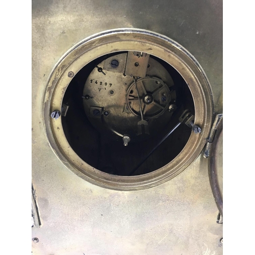 1412 - A Victorian brass mantle clock with Arabic numerals in a classic style.