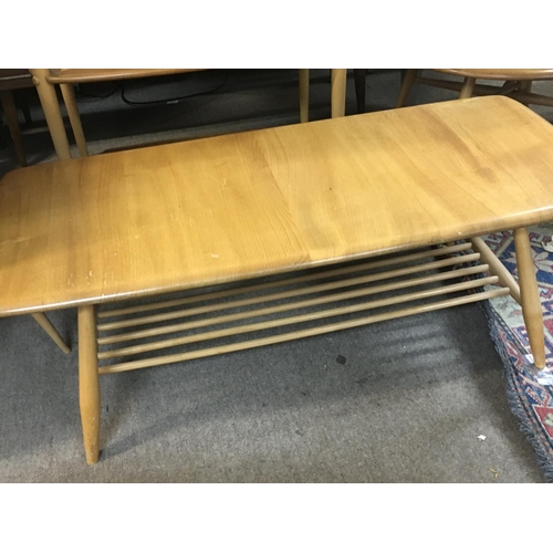 1524 - A Ercol rectangle coffee table on turned legs .