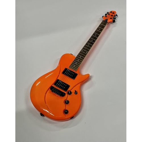 2399 - A Vibracell Switch Electric Guitar in bright orange finish -largely unplayed - comes with gigbag, le... 