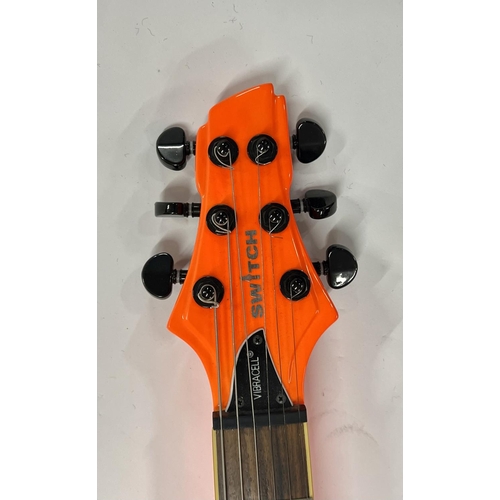 2399 - A Vibracell Switch Electric Guitar in bright orange finish -largely unplayed - comes with gigbag, le... 