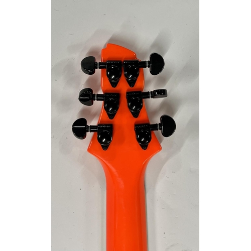 2399 - A Vibracell Switch Electric Guitar in bright orange finish -largely unplayed - comes with gigbag, le... 