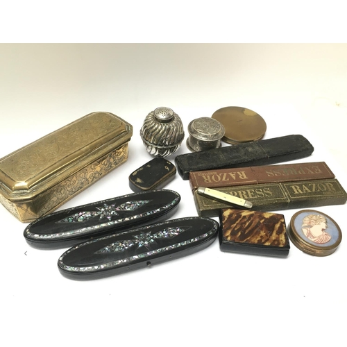 911 - A collection of items including Victorian Snuff boxes featuring brass, ebonised, cameo style and oth... 