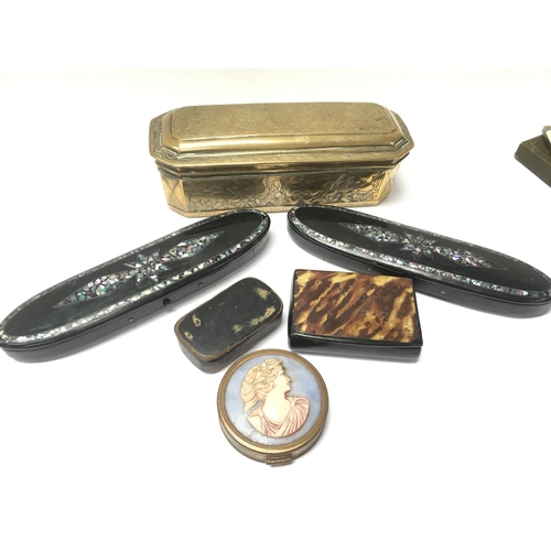 911 - A collection of items including Victorian Snuff boxes featuring brass, ebonised, cameo style and oth... 