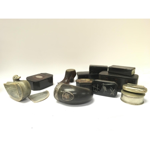 913 - A collection of Victorian snuff boxes including ebonised boxes, snuff mull, shoe box, duck (In need ... 