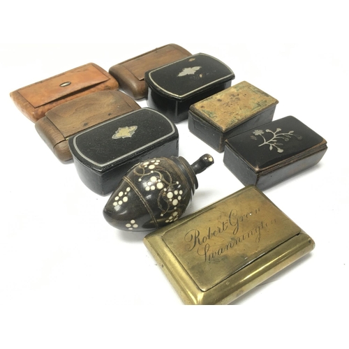 914 - A collection of various Victorian snuff boxes including wooden, ebonised and brass boxes. Postage ca... 