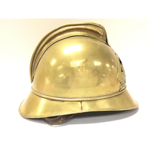 921 - A French brass firemans helmet, postage category C