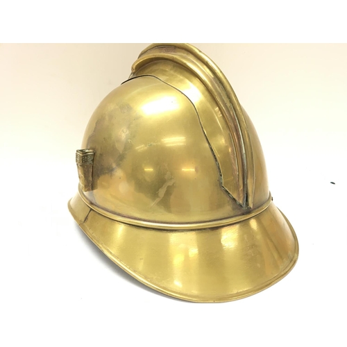 921 - A French brass firemans helmet, postage category C