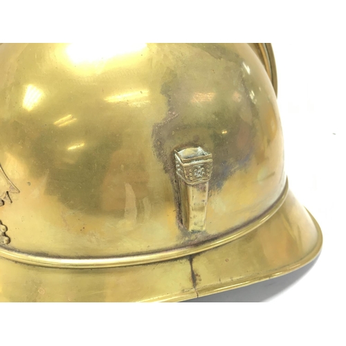 921 - A French brass firemans helmet, postage category C