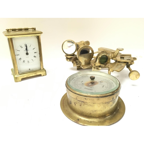 925 - A brass french carriage clock with wind up movement, brass sextant and small brass barometer. Postag... 