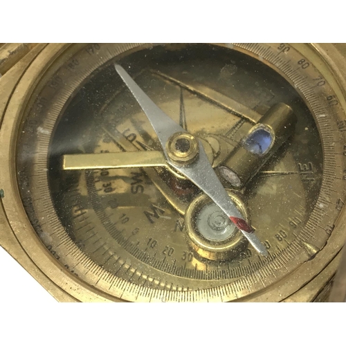 930 - A brass cased compass, postage category B