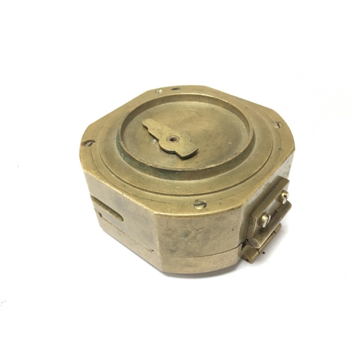 930 - A brass cased compass, postage category B