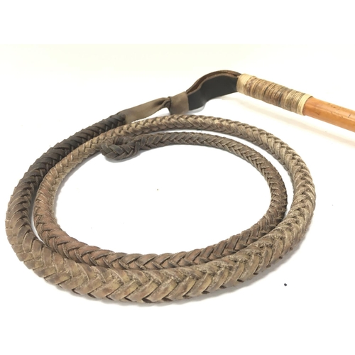 932 - An Ashford Malacca hunting whip dated 1893, approximately 71cm long. Postage category D