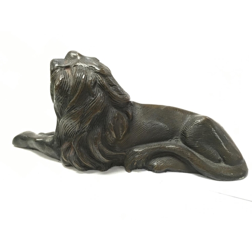 935 - A bronze lion figure , 8cm tall. Postage category B