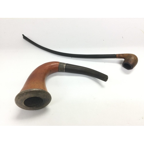 946 - Two smoker's pipes including a silver mounted example. Shipping category B.