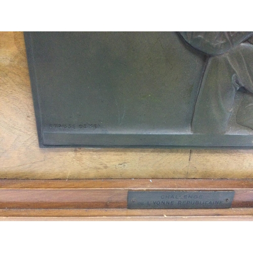 966 - A bronzed olympic shooting plaque mounted on a wooden base by Fraisse Demey, approx width 52.5cm. Sh... 