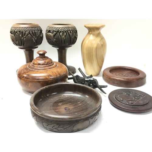 976 - A collection of trinket boxes, bowls and other wooden ornaments. Postage category D