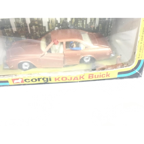 101 - A Corgi model KOJAK Buick with figures. Repro box.