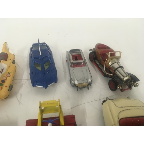 114 - An assorted collection of 10 Playworn model vehicles including from James Bond. Green Hornet etc.