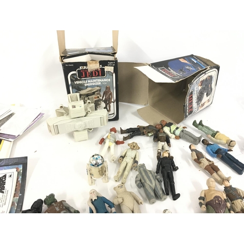 122 - A collection of vintage STAR WARS figures . Also includes accessories ..post cards..weapons and back... 