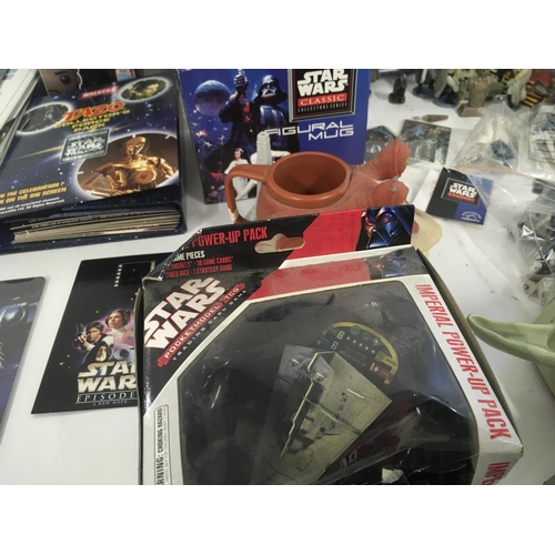 126 - A collection of modern Star Wars toys..books..figures etc.