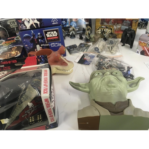 126 - A collection of modern Star Wars toys..books..figures etc.