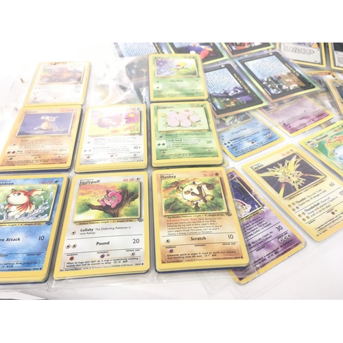 131 - A collection of original POKÃMON cards.