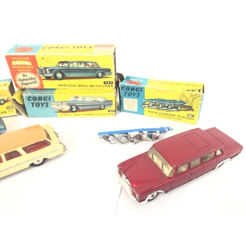 18 - A Boxed Corgi Lotus Elan #318. A Mercedes Benz 600 Pullman #247. A Four Furrow Plough #61 and a Plym... 