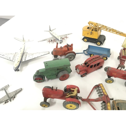 183 - A collection of Playworn model diecast vehicles primarily by Dinky..also some accessories included.