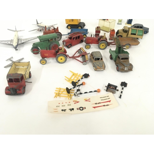 183 - A collection of Playworn model diecast vehicles primarily by Dinky..also some accessories included.