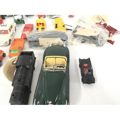 184 - A collection of model diecast vehicles by Dinky. Burago Triang and others. Triang minic clockwork Mo... 